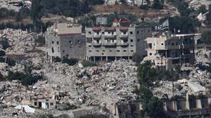 epaselect epa13070679 An Israeli flag waves atop a destroyed house in the southern Lebanese village of Meiss al-Jabal, as seen from the Israeli side of the border in the Upper Galilee, northern Israel, 28 June 2026, amid an Israel-Lebanon ceasefire.  EPA/ATEF SAFADI