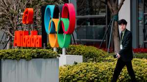 epa12832581 A man walks past Alibaba logo on their building in Xuhuibinjiiang Park, also known as 'AI Park,' home to many Chinese companies involved in AI (artificial intelligence) research, in Shanghai, China, 19 March 2026.  EPA/ALEX PLAVEVSKI