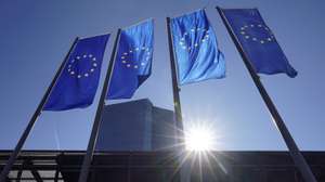 epa09814349 A view of flags in front of the European Central Bank (ECB) in Frankfurt am Main, Germany, 10 March 2022. The ECB Governing Council will hold a monetary policy meeting on 10 March.  EPA/RONALD WITTEK