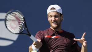 epa10153260 Joao Sousa of Portugal returns the ball to Cameron Norrie of England in their second round match during the US Open Tennis Championships at the USTA National Tennis Center in in Flushing Meadows, New York, USA, 01 September 2022. The US Open runs from 29 August through 11 September.  EPA/CJ GUNTHER
