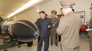 epa10546328 A photo released by the official North Korean Central News Agency (KCNA) shows North Korean leader Kim Jong Un speaking to officials during a visit to the Nuclear Weapons Institute in Pyongyang, North Korea, 27 March 2023 (issued 28 March 2023). According to KCNA, North Korean leader Kim Jong Un 'guided the work for mounting nuclear warheads on ballistic missiles' at the institute.  EPA/KCNA   EDITORIAL USE ONLY