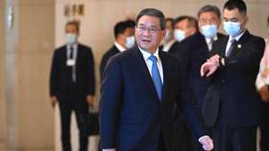 epa10711868 Chinese Premier Li Qiang attends a bilateral meeting with Director-General of the World Trade Organization Ngozi Okonjo-Iweala ahead of the annual World Economic Forum New Champions meeting, in Tianjin, China, 26 June 2023.  EPA/WANG Zhao / POOL