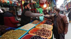 epa11214005 A Kashmiri Muslim man buys dry fruits ahead of the holy fasting month of Ramadan in Srinagar, the summer capital of Indian Kashmir, 11 March 2024. The Muslims' holy month of Ramadan, which is expected to start on 12 March in Kashmir, is the ninth month in the Islamic calendar, and it is believed that the revelation of the first verse in the Koran was during its last 10 nights. It is celebrated yearly by praying during the night and abstaining from eating, drinking, and sexual acts during the period between sunrise and sunset. It is also a time for socializing, mainly in the evening after breaking the fast, and a shift of all activities to late in the day in most countries.  EPA/FAROOQ KHAN