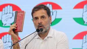 epa11390006 Indian National Congress Party senior leader Rahul Gandhi holds a copy of the Indian constitution as he speaks during a press conference at Congress headquarters in New Delhi, India, 04 June 2024. Bharatiya Janata Party (BJP) leader and Indian Prime Minister Narendra Modi claimed victory in the 2024 India elections which started on 19 April. The Lok Sabha elections were held for 545 lower house seats, and a party or alliance needs 272 seats to form a government.  EPA/RAJAT GUPTA