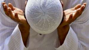 epa11417157 An Indian Muslim attends morning prayers on the occasion of Eid al-Adha or Bakrid, in Bangalore, India, 17 June 2024. Eid al-Adha is the holiest of the two Muslims holidays celebrated each year. It marks the yearly Muslim pilgrimage (Haj) to visit Mecca, the holiest place in Islam. Muslims slaughter a sacrificial animal and split the meat into three parts, one for the family, one for friends and relatives, and one for the poor and needy.  EPA/JAGADEESH NV