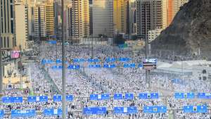 epaselect epa11414878 Muslim pilgrims attend the symbolic stoning of the devil ritual at the Jamarat Bridge during the Hajj pilgrimage near Mecca, Saudi Arabia, 16 June 2024. Hajj pilgrims took part in the 'stoning of the devil' ritual on the first day of Eid al-Adha during which they throw pebbles at three large pillars. Saudi authorities said that over 1.5 million pilgrims arrived in Saudi Arabia for this year's Hajj season. Muslims attending this year's Islamic Hajj pilgrimage will face the challenge of a significant rise in temperatures, which poses a threat to the health of pilgrims, according to the Ministry of Health statement, as the National Center for Meteorology (NCM) expected temperatures to range between 45 and 48 degrees Celsius at the holy sites.  EPA/STRINGER