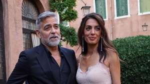 epa10831909 US actor George Clooney (L) and his wife Amal Alamuddin arrive to attend the ceremony for the Diane Von Furstenberg Award (DVF), in the Sala degli Arazzi of the Giorgio Cini Foundation in Venice, Italy, 31 August 2023. The DVF Award coincides with the 80th annual Venice International Film Festival running from 30 August to 09 September 2023. Diane Von Furstenberg is a Belgian fashion designer who founded the DVF Awards in 2010 to recognize and support extraordinary women.  EPA/ANDREA MEROLA