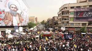 epaselect epa11514378 People gather around a truck carrying the coffins of Hamas late political leader Ismail Haniyeh and his bodyguard, during a funeral procession in Tehran, Iran, 01 August 2024. Haniyeh and one of his bodyguards were targeted and killed in Tehran on 31 July 2024, the Iranian Revolutionary Guard Corps (IRGC) confirmed.  EPA/ABEDIN TAHERKENAREH