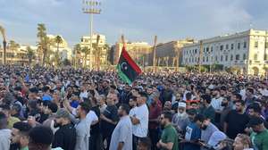 epa12107270 Libyans protest to demand the resignation of the national unity government led by Abdel Hamid Dbeibah and for the dismantling of armed groups in Tripoli, Libya, 16 May 2025. The warring parties in Tripoli have reached a temporary ceasefire agreement in an attempt to contain the escalating tensions that have gripped the city in recent days. The Ministry of Defense of the Government of National Accord in Tripoli announced that it calls on all parties to adhere to the ceasefire and avoid any statements or actions that could escalate tensions on the ground. In a statement, the ministry confirmed that it has begun deploying "neutral units" in an effort to maintain security and prevent further clashes in the capital.  EPA/STRINGER