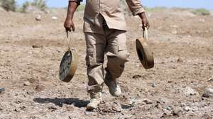 epa08230730 Explosives experts collect mines and explosives allegedly planted by the Houthi rebels, at a position in the southwestern city of Mocha, Yemen, 20 February 2020. According to reports, a Saudi-backed project for landmines clearance in Yemen has managed to clear a total of 123,000 land mines and explosives allegedly planted by the Houthi rebels during the ongoing fighting between the Saudi-backed government forces and the Houthis across Yemen.  EPA/NAJEEB ALMAHBOOBI