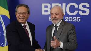 epa12219202 Brazilian President Luiz Inacio Lula da Silva (R) greets Chinese Prime Minister Li Qiang (L), during a meeting at Copacabana Fort in Rio de Janeiro, Brazil, 05 July 2025. Rio de Janeiro will host the 17th annual BRICS summit taking place on 06 and 07 July.  EPA/ANDRE COELHO