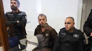 epa12929418 Thiago Avila (C), a member of the Global Sumud Flotilla, arrives to attend his trial for a remand extension at the Ashkelon Magistrate's Court in Ashkelon, Israel, 03 May 2026. Thiago Avila along with Abu Keshek were arrested on 02 May off the island of Crete, according to the organization. According to the Israeli Ministry of Foreign Affairs, Abu Keshek is suspected of affiliation with a terrorist organization, and Avila of illegal activity.  EPA/ABIR SULTAN