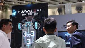 epa12912816 Visitors chat at the Huawei stand of the 2026 Beijing International Automotive Exhibition in Beijing, China, 25 April 2026. The Beijing International Automotive Exhibition is held in Beijing every two years and it goes from 24 April until 03 May.  EPA/WU HAO