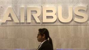 epa12799437 A person walks in front of the Airbus logo at the newly inaugurated Airbus India Technology Centre in Bangalore, India, 06 March 2026. The French aerospace company Airbus inaugurates its new India Technology Centre in Bengaluru, a 13-floor, 880,000 sq. ft. facility designed to accommodate about 5,000 employees, marking a major expansion. The new facility serves as a hub for engineering, digital transformation, customer services, and its strategic footprint in India, and is the largest fulfilment office in Bangalore.  EPA/JAGADEESH NV