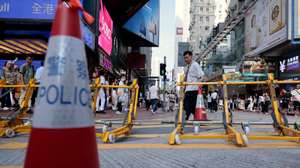 epa13015051 A plain clothes police sets up barricades near Victoria Park, in Hong Kong, China, 04 June 2026. The park is historically where the now-disbanded Hong Kong Alliance in Support of Patriotic Democratic Movements of China organised annual candlelight vigils since 1990 to mourn the victims of China's 1989 Tiananmen Square crackdown. The vigil, once the only large-scale public commemoration of the crackdown on Chinese soil, has been banned since Beijing imposed a national security law on Hong Kong in 2020.  EPA/MAY JAMES