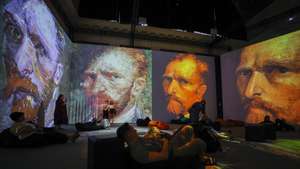 epaselect epa13044949 Visitors attend the immersive exhibition 'Van Gogh's Universe' in Kyiv, Ukraine, 17 June 2026, amid the Russian invasion. Making its debut in the Ukrainian capital, the international multimedia display utilizes Digital Art 360 technology to map animated versions of Dutch Post-Impressionist painter Vincent van Gogh's iconic works onto the floors and walls of the gallery space.  EPA/SERGEY DOLZHENKO