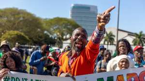 epa13175846 Supporters of the anti-immigration group 'March and March' protest outside the 46th Ordinary SADC Summit of Heads of State and Government at the Durban International Conference Centre in Durban, South Africa, 17 August 2026. The anti-migrant group called on the SADC leaders whose citizens are living in South Africa without proper documentation to 'Come fetch your people.' The controversial anti-migrant movement has led protests calling for undocumented foreign nationals to leave South Africa, including a nation wide shut down on 30 June 2026.  EPA/STRINGER