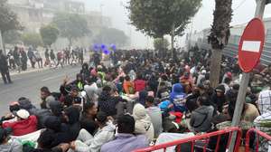 epa13206336 Migrants continue to wait outside the Loma Colmenar migrant temporary shelter in Ceuta, Spain, 02 September 2026. Spain has been facing a migration crisis after thousands of people crossed into the North African enclave of Ceuta from Morocco in late July 2026.  EPA/Reduan