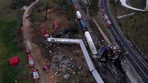 epa10496411 A picture taken with a drone shows firefighters and rescue crews working to extricate passengers from trains after a collision near Larissa city, Greece, 01 March 2023. At least 32 people were killed and more than 85 were injured when a passenger train collided with a freight train, in Tempi, central Greece, near the city of Larissa, the Greek Fire Service said. Out of the 85 injured persons, 53 still remain in hospital, according to the spokesperson of the Fire Service, Vassilis Vathrokogiannis. Rescue workers continue the search for survivors focusing on the first two carriages of the passenger train.  EPA/ACHILLEAS CHIRAS