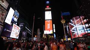 epa09429723 A general view of Times Square and the 110 feet (33.5 meters) tall Times Square Wheel, a ferris wheel which was constructed in Times Square in New York, New York, USA, 25 August 2021. The attraction will operate until 12 September.  EPA/JASON SZENES