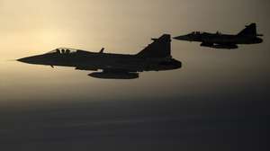 epa12521453 Two JAS-39C Gripen fighter aircrafts of the Hungarian Defense Forces (HDF) fly during an alert response simulation at the Siauliai Air Base of NATO's Baltic Air Policing (BAP) mission near Siauliai, Lithuania, 12 November 2025, as seen from a Hungarian Air Force plane. Since the beginning of August, Hungarian pilots responded to 20 live alerts, and conducted 76 practice intercepts and 53 training flights.  EPA/ROBERT HEGEDUS HUNGARY OUT