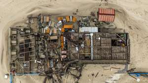 epa12704860 An aerial view shows buildings damaged by Storm Kristin in Praia da Vieira, in Marinha Grande municipality, Portugal, 04 February 2026. The Portuguese government has declared a state of disaster for many municipalities in the Leiria and Coimbra districts, struck by Storm Kristin in late January 2026. As of 04 February 2026, parts of the region are under orange and yellow alerts due to Storm Leonardo.  EPA/PEDRO CASTANHEIRA E CUNHA