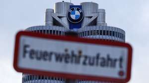 epa12727565 An exterior view of the BMW main tower at BMW headquarters in Munich, Germany, 11 February 2026. BMW said it is recalling hundreds of thousands of cars worldwide that can catch fire while driving.  EPA/RONALD WITTEK