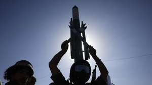 epa13292211 A Houthi supporter holds up a mock rocket during a protest against Saudi Arabia, in Sana'a, Yemen, 09 October 2026. Thousands of Houthi supporters rallied in Sana'a to protest against Saudi Arabia amid an escalation in fighting after Yemen's Saudi-backed government announced a military campaign on 04 October to retake Houthi-held territory.  EPA/YAHYA ARHAB