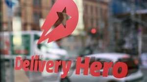 epa11714575 The Delivery Hero's logo is seen at the company's headquarters in Berlin, Germany, 11 November 2024. The German food delivery service Delivery Hero recently presented details for the planned IPO of its subsidiary Talabat in Dubai. It could be one of the largest IPOs in the region this year. To pursue an initial public offering (IPO) of 15 percent of the total issued shares of Talabat Holding plc. The aim is for all shares to be listed by mid-December, the MDax-listed company announced in Berlin.  EPA/HANNIBAL HANSCHKE