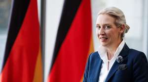 epa13067057 Alternative for Germany (AfD) party and parliamentary group co-chairwoman Alice Weidel speaks during an interview in front of Germany flags during 1st Democracy Congress of the AfD parliamentary group in Berlin, Germany, 26 June 2026.  EPA/CLEMENS BILAN