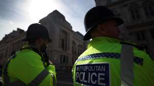 epa11557737 Policemen keep watch in London, Britain, 21 August 2024. According to the a recent study by the Youth Endowment Fund (YEF), 'stop and search' tactics by British police has proved ineffective. The study highlighted stop and search did little to curb rising violence and knife crime. Moreover, black people are four times more likely to be targeted by police for a stop and search than white people, the study said.  EPA/ANDY RAIN