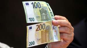 epa07596699 A view of new euro banknotes in Riga, Latvia, 24 May 2019. Latvia will be launching new 100 euro and 200 euro banknotes On 28th May 2019. These are the latest European series of banknotes with refurbished design and advanced security features.  EPA/Toms Kalnins