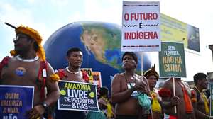 epa12527554 Indigenous people attend the Global Climate March in defense of forests, indigenous land rights and global climate responsibility in Belem, Brazil, 15 November 2025. The protest was organized on the sidelines of the COP30 UN Climate Change Conference, that runs from 10 to 21 November.  EPA/ANDRE BORGES
