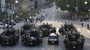 epa12167309 Police fill the street as they face off with protesters in Los Angeles, California, USA, 09 June 2025. Approximately 2,000 National Guard troops were deployed on 08 June in Los Angeles by US President Donald Trump, though the state of California had not requested any additional assistance, and protests have continued against the Trump administration's immigration enforcement raids over the last couple of days.  EPA/CAROLINE BREHMAN