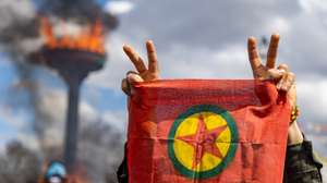 epa11978437 Supporters of The Peoples' Equality and Democracy Party (DEM) hold a flag of the Kurdistan Workers' Party (PKK), and shout slogans next to a bonfire during a rally for Newruz celebrations in Diyarbakir, Turkey, 21 March 2025. Newroz or Nowruz, which means 'new day' in the Persian language, marks the arrival of spring and the first day in the Iranian calendar. It is widely celebrated in the Persian and neighboring regions and recognized on the UNESCO List of the Intangible Cultural Heritage of Humanity.  EPA/METIN YOKSU