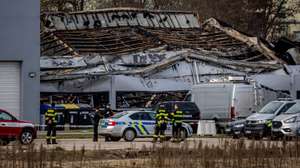 epa12836323 Firefighters and police stand guard at the site of a burned warehouse owned by Czech arms maker LPP Holding in Pardubice, Czech Republic, 20 March 2026. A group calling itself 'The Earthquake Faction' has claimed responsibility for the attack. The Security Information Service (BIS) is cooperating in the investigation with the National Centre against Terrorism, Extremism and Cybercrime on suspicion of a terrorist attack. No one was injured.  EPA/MARTIN DIVISEK