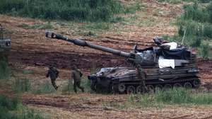 epa12851270 An Israeli artillery unit deployed on the Israel-Lebanon border shells targets across the frontier in Lebanon, northern Israel, 26 March 2026. Israel resumed operations in Lebanon in early March 2026, targeting Hezbollah's infrastructure and personnel.  EPA/ATEF SAFADI