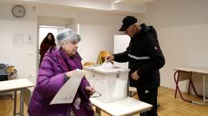 epa12841299 Slovenian citizens vote during the parliamentary election at a polling station in Ljubljana, Slovenia, 22 March 2026. The 22 March 2026 parliamentary election follows reports of an alleged covert operation by the Israeli intelligence firm Black Cube to influence the vote.  EPA/ANTONIO BAT