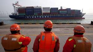epa07283408 (FILE) - A file photo dated 11 January 2013 showing dockers watching a container ship preparing to berth at the port of Qingdao, in Qingdao city, eastern China's Shandong province (reissued 14 January 2019). Reports on 14 January 2019 state the value of China's exports and imports suffered in the 12 months to December 2018. The value of goods exported fell most in two years to 4.4 per cent in December, while December 2018 import figures fell 7.6 per cent.  EPA/WU HONG *** Local Caption *** 50657137