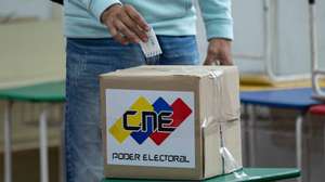 epa11448086 A Venezuelan man casts his ballot in the electoral drill in a polling center in Caracas, Venezuela, 30 June 2024. The polling centers enabled for the drill of the upcoming July 28 presidential elections in Venezuela began to open their doors after 8:00 local time (12:00 GMT) with scarce attendance, which is expected to increase throughout the day.  EPA/RONALD PENA R