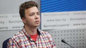 epa09270675 A handout photo made available by Belta shows Belarusian opposition activist Roman Protasevich attends a press conference by Belarusian Foreign Ministry on Ryanair Athens-Vilnius flight on 23 May at the National Press Center in Minsk, Belarus, 14 June 2021. Belarus' opposition journalist Roman Protasevich was detained by Belarusian Police on 23 May 2021 on a Ryanair flight from Athens to Vilnius, that was forced to land in Minsk.  EPA/RAMIL NASIBULIN / BELTA / HANDOUT  HANDOUT EDITORIAL USE ONLY/NO SALES