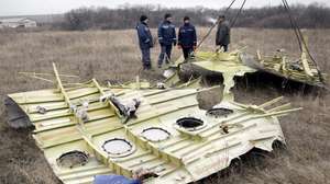 epa04494229 Workers remove parts of the wreckage of Malaysia Airlines passenger jet MH17 at the crash site in rebel-held Grabovo village, about 70 km from Donetsk, Ukraine, 18 November 2014. The Malaysian Airlines plane, which was flying from Amsterdam to Kuala Lumpur, was shot down over Ukraine in July. All 298 people on board were killed. Debris will be transported to the Netherlands for investigation, the Dutch Safety Board said. Access to the site has previously been limited by the rebels, and the ongoing conflict in Ukraine.  EPA/ALEXANDER ERMOCHENKO
