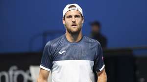 epa10410999 Joao Sousa of Portugal in action against Roberto Bautista Agut of Spain  during their first round match at the Australian Open tennis tournament in Melbourne, Australia 17 January 2023.  EPA/FAZRY ISMAIL