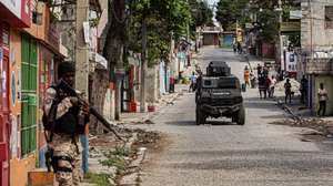 epaselect epa12714792 A member of the police guards an area in Port-au-Prince, Haiti, 07 February 2026. Prime Minister Alix Didier Fils-Aime said he was aware of the responsibilities he assumes as he takes executive power and pledged to get to work immediately.  EPA/Mentor David Lorens