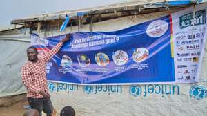 epa13190900 A staff member explains Ebola virus prevention measures to refugees in the CECA camp in Mambasa, Ituri province, Democratic Republic of Congo, 25 August 2026. The local branch of the New Civil Society of Congo (Nouvelle Societe Civile du Congo SOCICO) reported that delays in laboratory results are fueling community resistance to Ebola response measures, compounded by ongoing insecurity in the area.  EPA/DIEUDONNE DIROLE