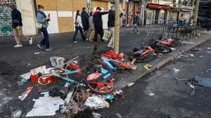 epa13313419 Debris remains in the street in the aftermath of clashes between riot police and demonstrators during nationwide protests against the high cost of living in the country, in Paris, France, 18 October 2026.  EPA/MOHAMMED BADRA