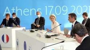 epa09473758 Greek Prime Minister Kyriakos Mitsotakis (R), President of the European Commission Ursula von der Leyen (R2) and French President Emmanuel Macron (L) participate at the EUMed9 Summit, in Athens, Greece, 17 September 2021.The agenda of the Summit, which acquires special geopolitical weight, includes security challenges in the Mediterranean that endanger stability in the region, potential new crises, such as the threat of migration flows after the latest developments in Afghanistan, and other crises, the consequences of which Mediterranean countries are already experiencing, such as climate change.  EPA/ORESTIS PANAGIOTOU