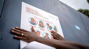 epa12978406 A staff with the non-governmental organization AGIR-RDC that promotes medical access, displays a poster describing preventive measures against Ebola, in Goma, North Kivu, Democratic Republic of Congo, 20 May 2026. The World Health Organization (WHO) has reported over 130 deaths linked to the outbreak of the Bundibugyo variant of Ebola in the Democratic Republic of the Congo, officially declared public health emergency of international concern (PHEIC).  EPA/MARIE JEANNE MUNYERENKANA