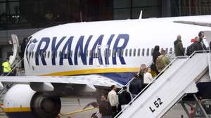 epa11310199 Passengers board a Ryanair group airplane at Riga Airport, Latvia, 30 April 2024. Riga Airport is the international airport of Riga, the capital of Latvia, and the largest airport in the Baltic states.  EPA/TOMS KALNINS