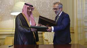 Portuguese Minister of State and Foreign Affairs, Paulo Rangel (R) flanked by his counterpart of Saudi Arabia, Faisal bin Farhan Al Saud (L) sign a memorandum of understanding after a meeting at Necessidades Palace, in Lisbon, Portugal, 16 June 2026. ANTONIO PEDRO SANTOS/LUSA